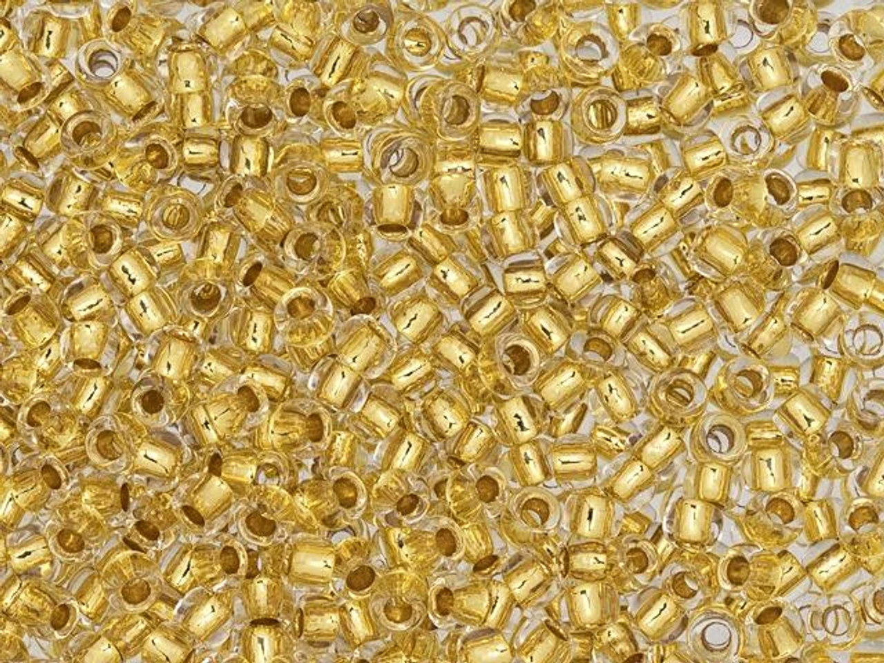 TOHO Glass Seed Bead, Size 8, 3mm, 24K Gold-Lined Crystal (Tube) 3 TOHO Glass Seed Bead, Size 8, 3mm, 24K Gold-Lined Crystal (Tube)